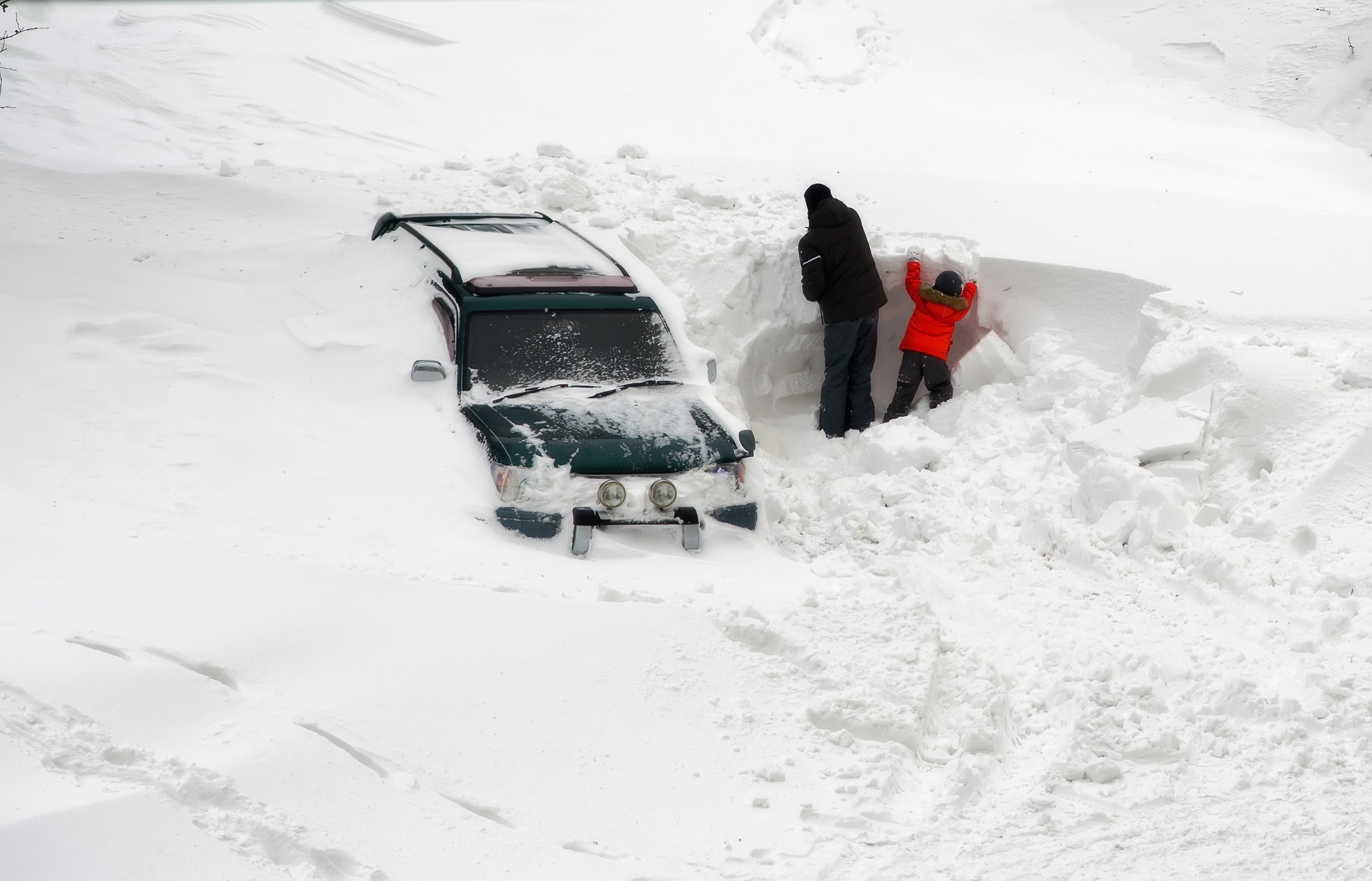 Car buried in snow